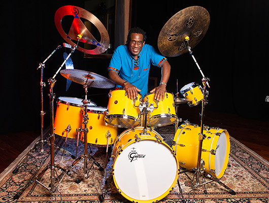 Will Calhoun behind a Gretsch USA Custom Kit in a Custom Grain Yellow Gloss